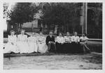Sitting Outside of Davis Hall (1887-1965), "LaVerne Fairchild holding court" (hand written on back) by University of North Dakota