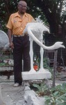 Bailey Standing by Bird Statue with Bent Neck by James Smith Pierce
