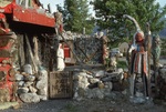 Yard Scene, Native Figure and Sign "Thunder Nest" by James Smith Pierce