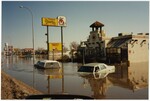 "Grand Forks Flood Evacuation. Looking N. on S. Washington Street" by Joan Erickson