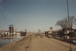 "Grand Forks Flood Evacuation. Looking N. on S. Washington Street" by Joan Erickson