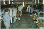 "Grand Forks Mission. Volunteers (from Bucks County, PA and Cridersville, OH) sorting clothes in Mission Thrift Store" by Alan Draves