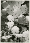 Shriner Handing Balloons to Circus Attendees