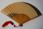 Hand-held fan - black and brown colorblock design by Maker Unknown
