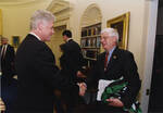Bob Feidler of the UND Alumni Association shakes President Bill Clinton's hand by United States. White House Photographic Office