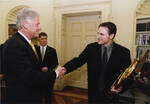 Team Captain Peter Armbrust meets President Bill Clinton by United States. White House Photographic Office