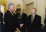 Co-Captain Jeff Panzer with President Bill Clinton by United States. White House Photographic Office