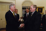 UND Head Hockey Coach Dean Blais with US President Bill Clinton by United States. White House Photographic Office