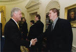 Team Member Brad DeFauw with President Bill Clinton by University of North Dakota