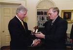UND Men's Hockey Coach Dean Blais with US President Bill Clinton by United States. White House Photographic Office